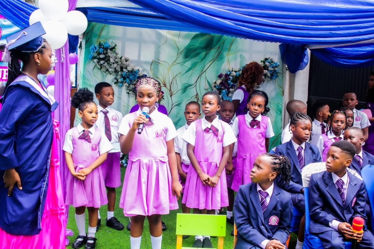 Graduating pupils with families and staff